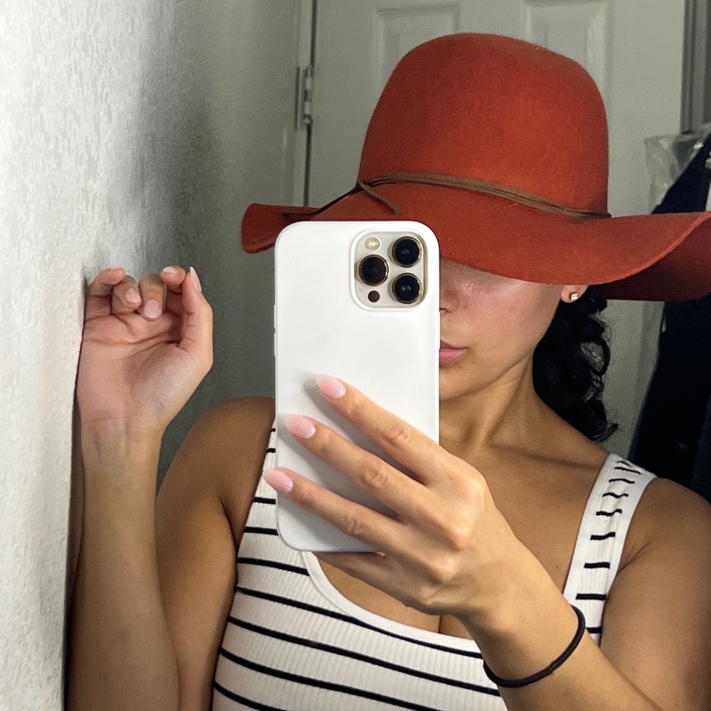 Brunt orange hat.